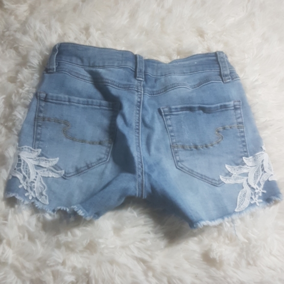 Blue shorts with white flower - Picture 2 of 2